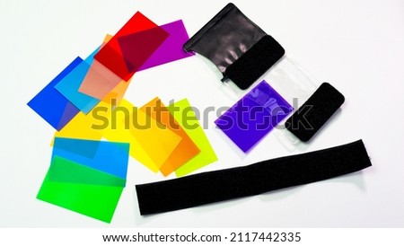 Top view Set of color filters for flash creative photography on white background. Creative photography color filters and lighting equipment.