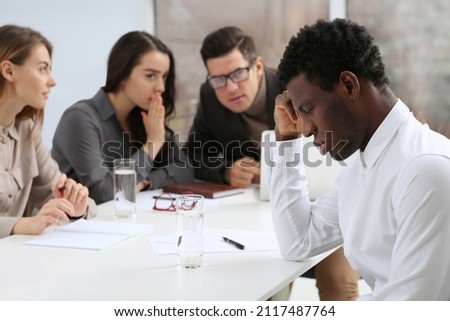 African American man suffering from racial discrimination at work Royalty-Free Stock Photo #2117487764