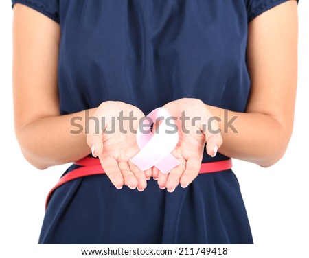 Woman with aids awareness pink ribbon in hands isolated on white