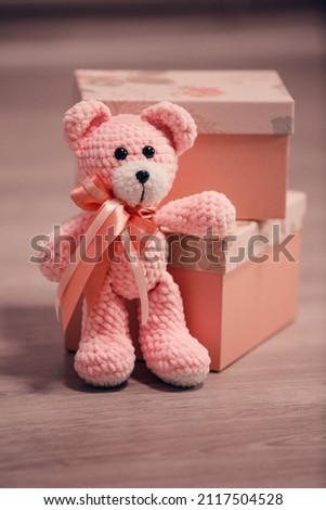 Soft toy bear. Pink plush toy for children.