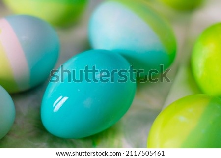 Easter eggs of blue and green color are painted at home independently on the eve of the Easter holiday.