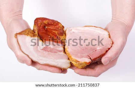 Hand closeup with smoked bacon