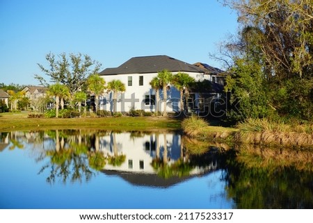  house and pond in a sunny day
