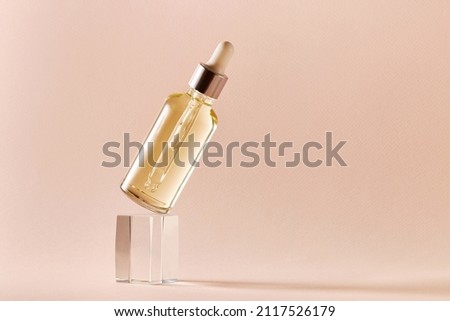 Essential oil in a glass dropper bottle with pipette. Herbal cosmetic, natural organic beauty product Royalty-Free Stock Photo #2117526179