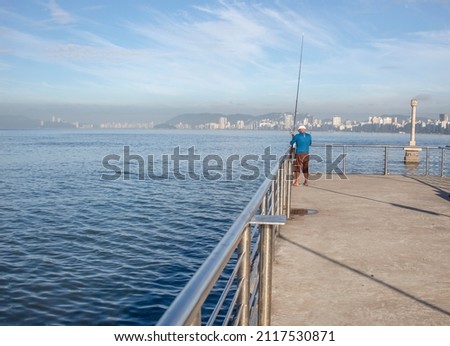 Old Man fishing in fisherman deck in Santos city - São Paulo.
Santos 02-03-2022