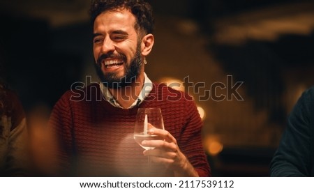 Big Dinner Garden Party Celebration with Friends on a Warm Summer Evening. Beautiful People Enjoy Life on Restaurant Outdoors Terrace, Talk, Relax on Weekend, Have Fun, Drink Wine and Eat Food. Royalty-Free Stock Photo #2117539112