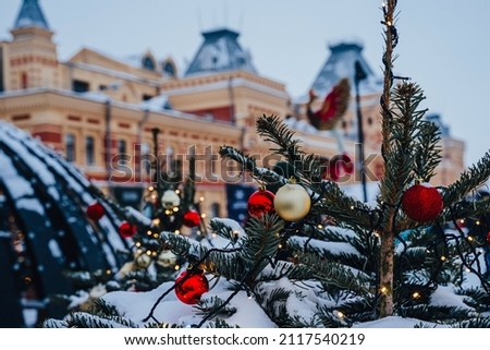 Christmas tree. Christmas fair in Nizhny Novgorod. Festive decorations. Exhibition Hall of the Nizhegorodskaya Yarmarka Fair in the background