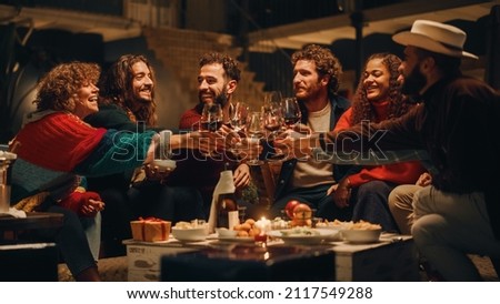 Big Dinner Garden Party Celebration with Friends on a Warm Summer Evening. Beautiful People Enjoy Life on a Terrace, Talk, Relax on Weekend, Have Fun, Drink Wine, Give Toasts and Eat Homemade Food. Royalty-Free Stock Photo #2117549288
