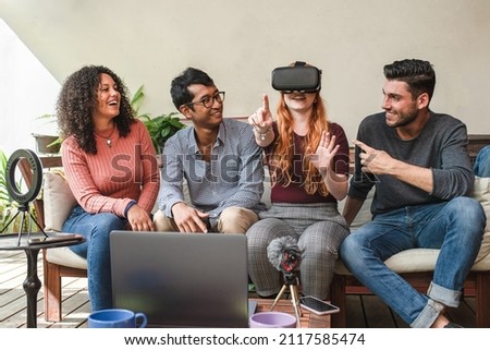Digital lifestyle and metaverse virtual reality, group of young people testing new headset with futuristic technology, teenager having fun playing with VR glasses