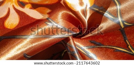 brown silk fabric with floral print, photo taken in bright light, texture background, pattern