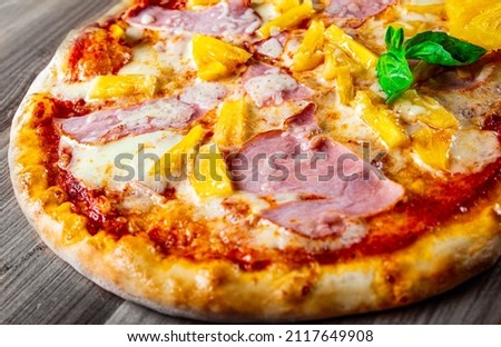 fast food. Hawaiian pizza with pineapple, ham, chicken, cheese, and vegetables