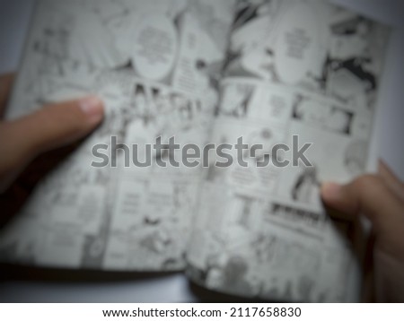 defocused illustration of reading Japanese comics 