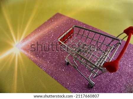 Shopping cart on pink carpet