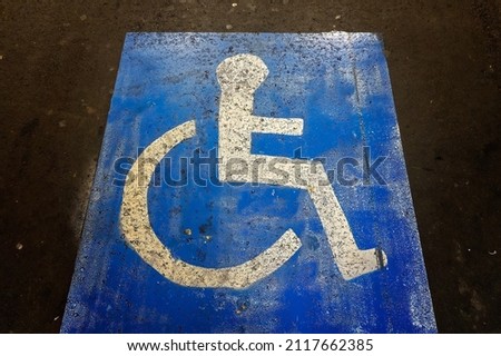Designated car parking bay for wheelchair customers in shopping center car park