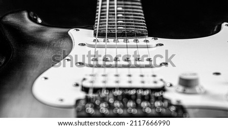 Musical instrument for rock, blues, metal songs. Guitar strings, close up. Electric Bass Guitars. Black and white.