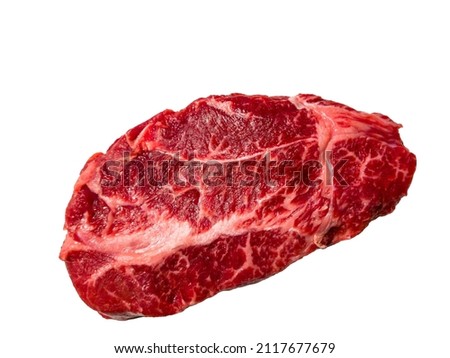 A Top Blade steak made of marbled beef lies on a white background. Isolated Royalty-Free Stock Photo #2117677679