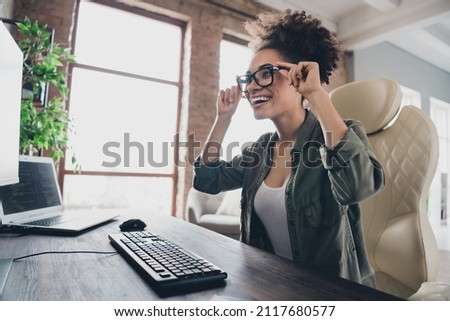 Photo of amazed excited lady sit desk use device touch glasses successful server security development in workplace