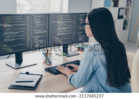Profile side view portrait of attractive focused girl ceo boss chief editing html java script at workplace workstation indoors Royalty-Free Stock Photo #2117681237