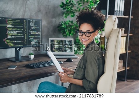Photo of lady editor sit desk hold check list support operating system start-up development report in workplace workstation Royalty-Free Stock Photo #2117681789