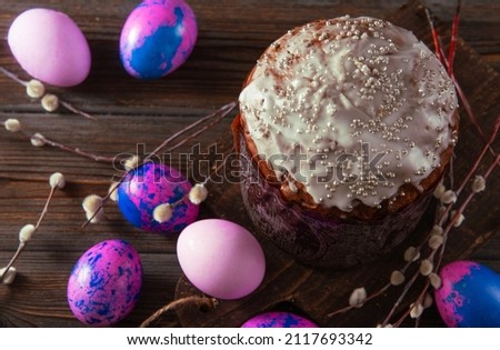 Easter cake with purple eggs and willow branches spring festive holidays minimal horizontal