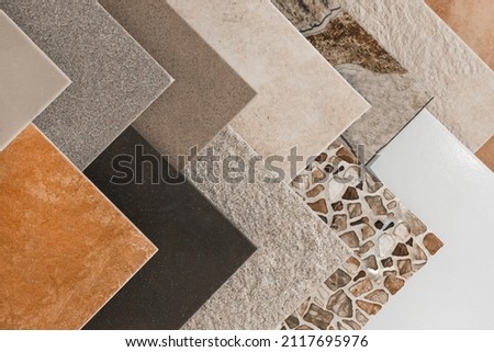 Colored samples of ceramic tiles for kitchen or bathroom interior material design of house, floor, porcelain stoneware. Royalty-Free Stock Photo #2117695976