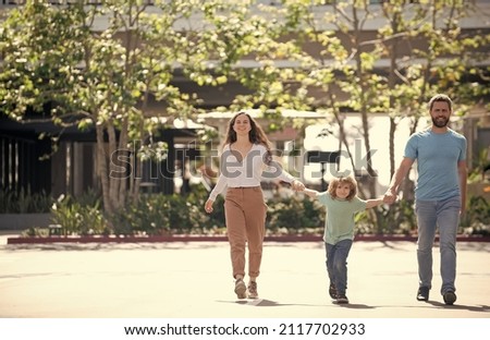 father mother and child in summer. friendly family. family weekend. happy parents with kid boy