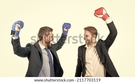 happy two businessmen in boxing gloves celebrate success isolated on white, business success