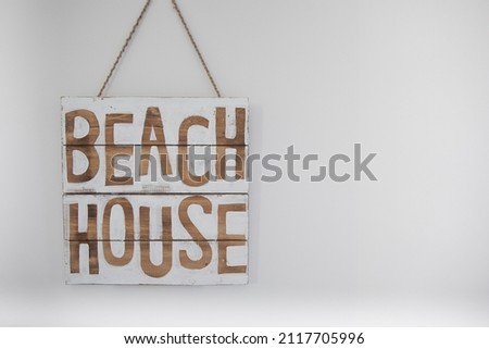 View of rustic beach house sign