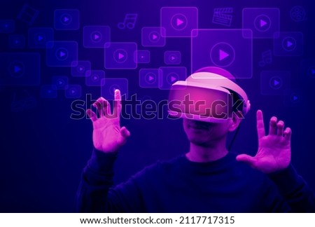 Man wearing VR glasses virtual touch Social networking service and Streaming video and music. Futuristic touch screen display with streaming image, communication network media online, technology 