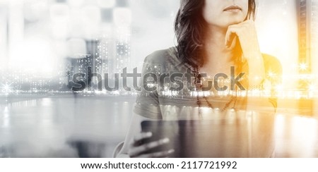 Making connections in the city. Multiple exposure shot of a businesswoman using a cellphone superimposed on a cityscape. Royalty-Free Stock Photo #2117721992
