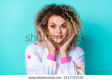 Photo of cute young wavy hairdo lady hands face wear pajama isolated on blue background