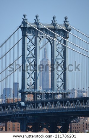 Manhattan Bridge with the Empire State Building in the background.