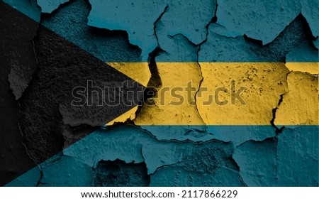 Flag of Bahamas on old grunge wall in background 