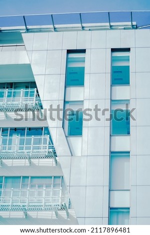 white tall building in bandung, indonesia on a sunny day