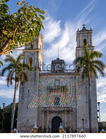Beautiful picture of the towers of the San Servacio Church in Valladolid in the middle of the Yucatan peninsula ( Mexico ), with its windows and flags in the colorful streets.