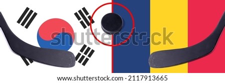 Top view hockey puck with South Korea vs. Chad command with the sticks on the flag. Concept hockey competitions
