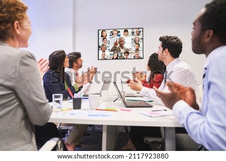 Applause at the business meeting with colleagues in the video conference