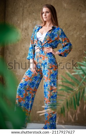 young slim beautiful woman on tropical resort, bohemian outfit, indie style