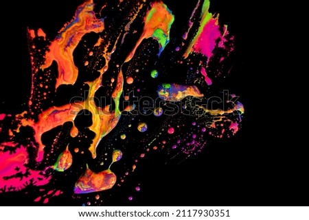 Abstract vibrant multi-color wet paint drops and splotch on black background. Bright orange and pink neon colors. Street art isolated Royalty-Free Stock Photo #2117930351