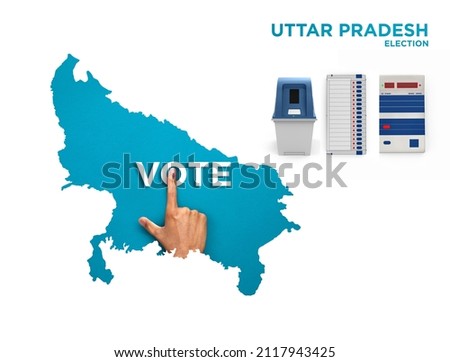VOTE FOR INDIA UTTAR PRADESH , male Indian Voter Hand with voting sign or ink pointing out , Voting sign on finger tip Indian Voting on blue background with Electronic voting machine Royalty-Free Stock Photo #2117943425