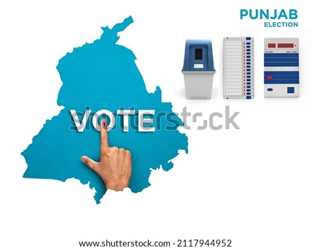 VOTE FOR INDIA PUNJAB , male Indian Voter Hand with voting sign or ink pointing out , Voting sign on finger tip Indian Voting on blue background Electronic voting machine Royalty-Free Stock Photo #2117944952