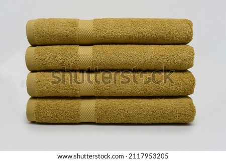 Yellow Folded Bath Towel Diamond Fancy Terry Texture Towel  Royalty-Free Stock Photo #2117953205