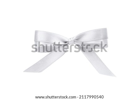 Beautiful silver ribbon tied in bow isolated on white, top view Royalty-Free Stock Photo #2117990540