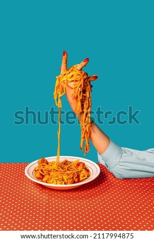 Surrealism. Food pop art photography. Female hands tasting spaghetti with meatballs on plaid tablecloth isolated on bright blue background. Vintage, retro style interior. Complementary colors