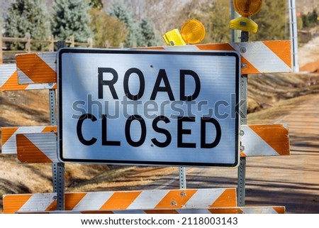 Road closed caution sign on highway in road reconstruction