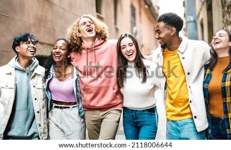 Life style concept with milenial friends walking together at old town center - Happy guys and girls having fun around Barcelona streets - University students on travel vacations  - Bright vivid filter Royalty-Free Stock Photo #2118006644
