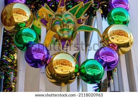 Closeup of Mardi Gras decorations on balcony in New Orleans, LA, USA