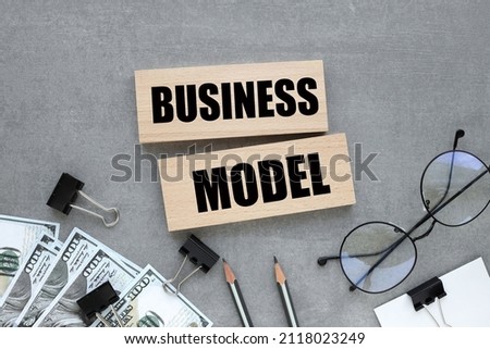 Business model two wooden blocks on gray background business concept
