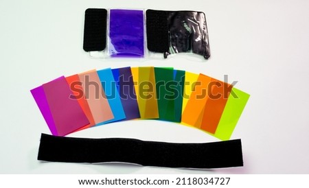 Overhead multi-colored filters for photography for external flash isolated on white background. Color filters for creative photography and lighting equipment
