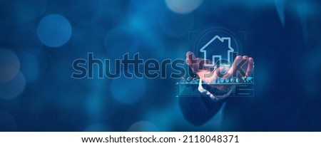 House icon on the hand, mortgage loan home and insurance real property mortgage concept. Royalty-Free Stock Photo #2118048371